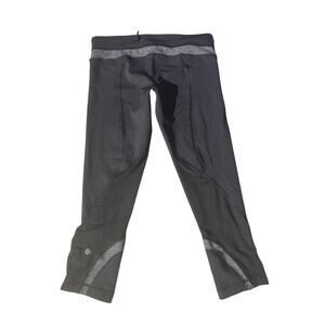 Lululemon Run: Inspire Crop II leggings with gray stripe pattern, size 8
